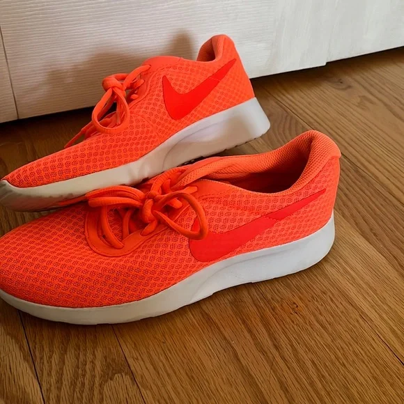 Neon orange Nike sneakers